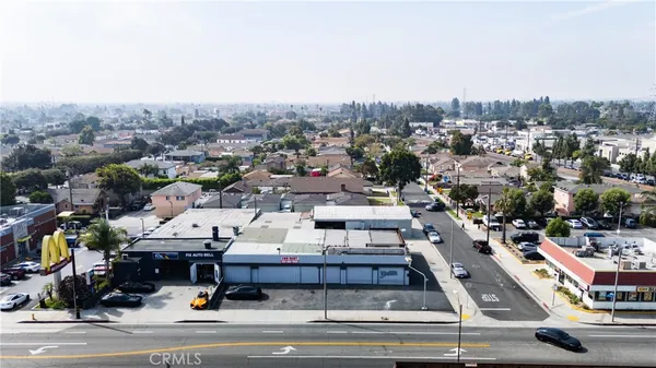 an aerial view of residential houses with city view