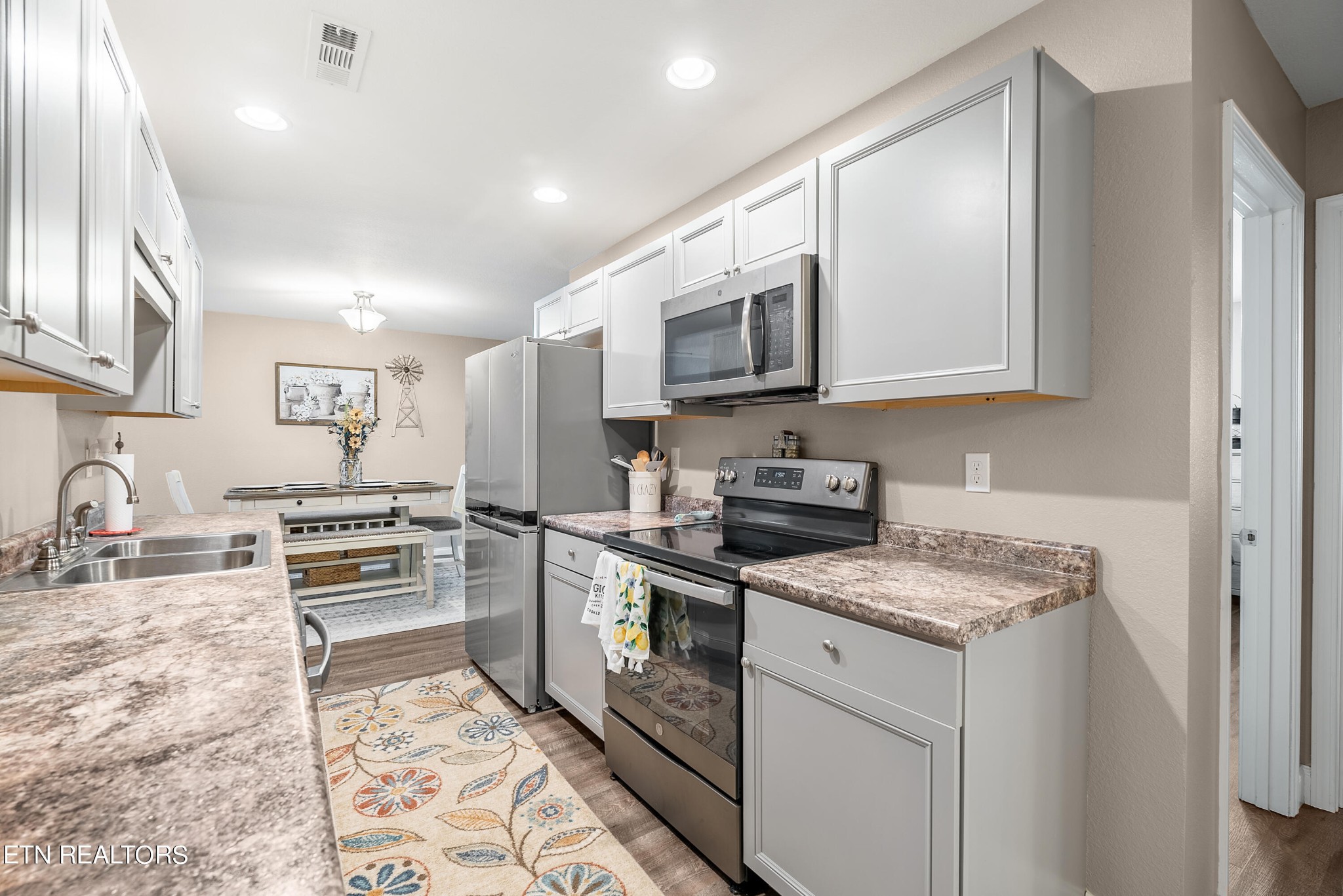 314 Two View Road Sevierville, TN 37863 - Photo 13 of 31 a kitchen with stainless steel appliances granite countertop a stove a sink and a microwave