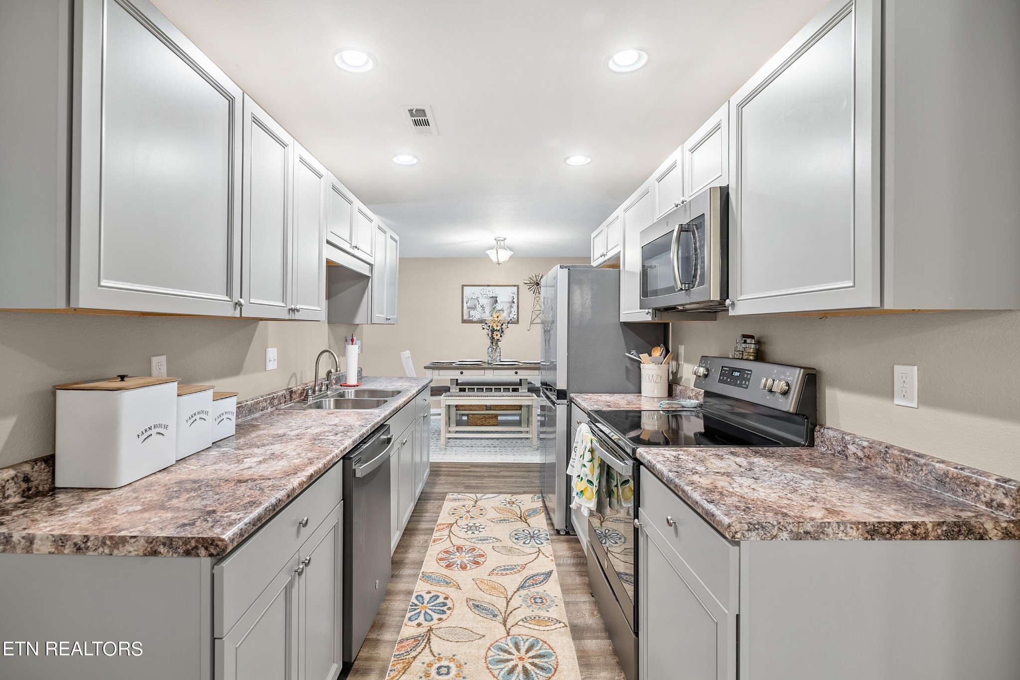 314 Two View Road Sevierville, TN 37863 - Photo 14 of 31 a kitchen with stainless steel appliances granite countertop a sink stove and refrigerator