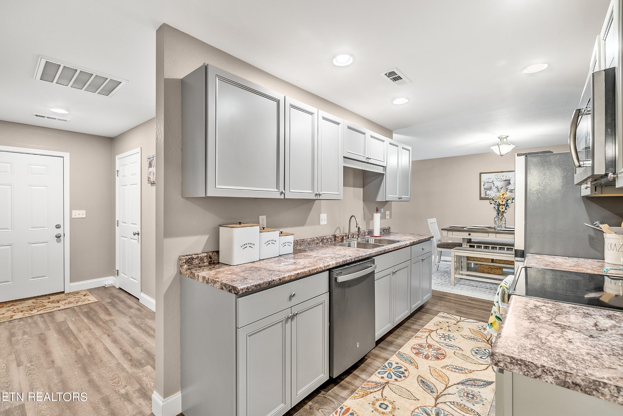 314 Two View Road Sevierville, TN 37863 - Photo 15 of 31 a kitchen with granite countertop cabinets stainless steel appliances a sink and a counter top space