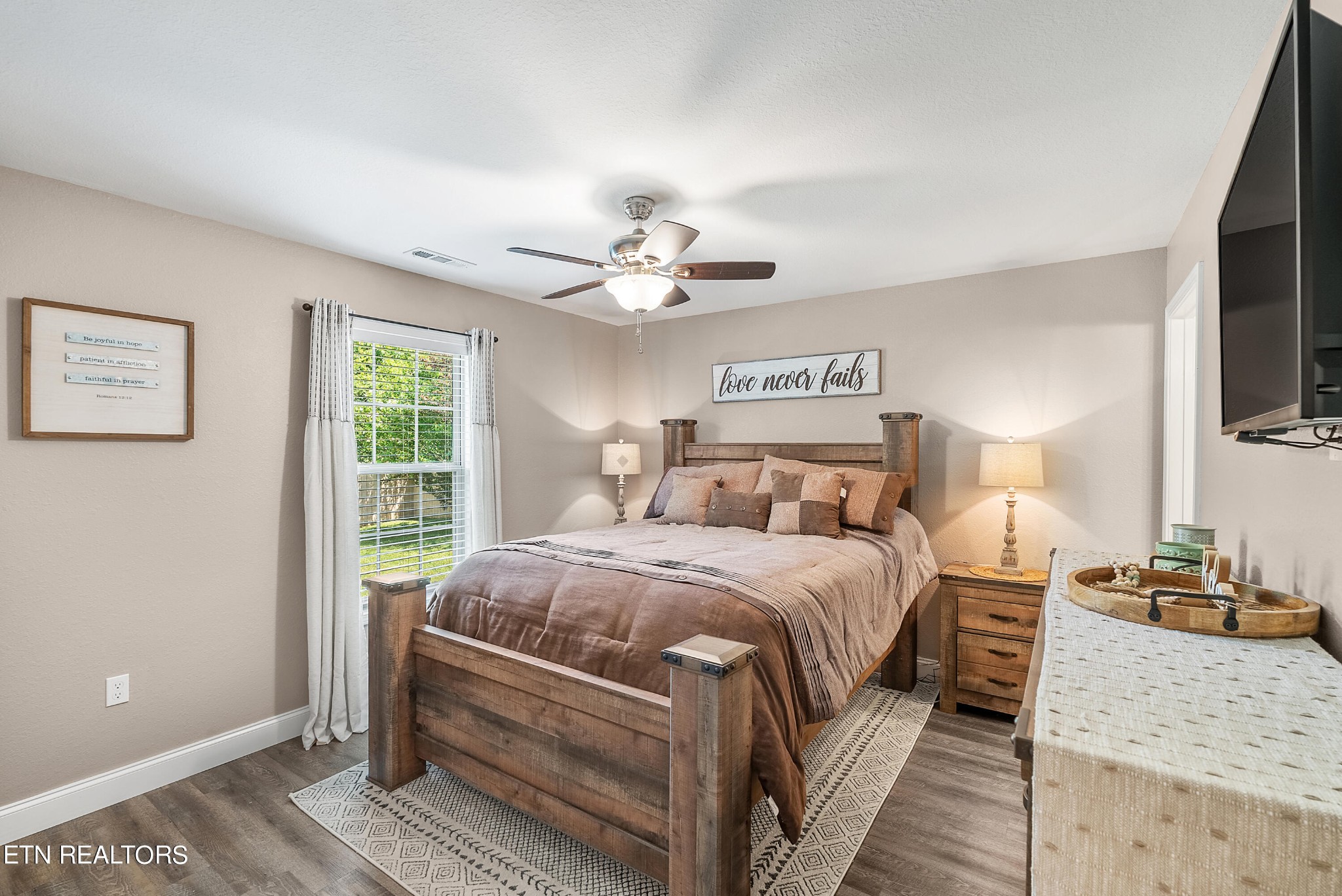 314 Two View Road Sevierville, TN 37863 - Photo 17 of 31 a bedroom with a large bed and a chandelier