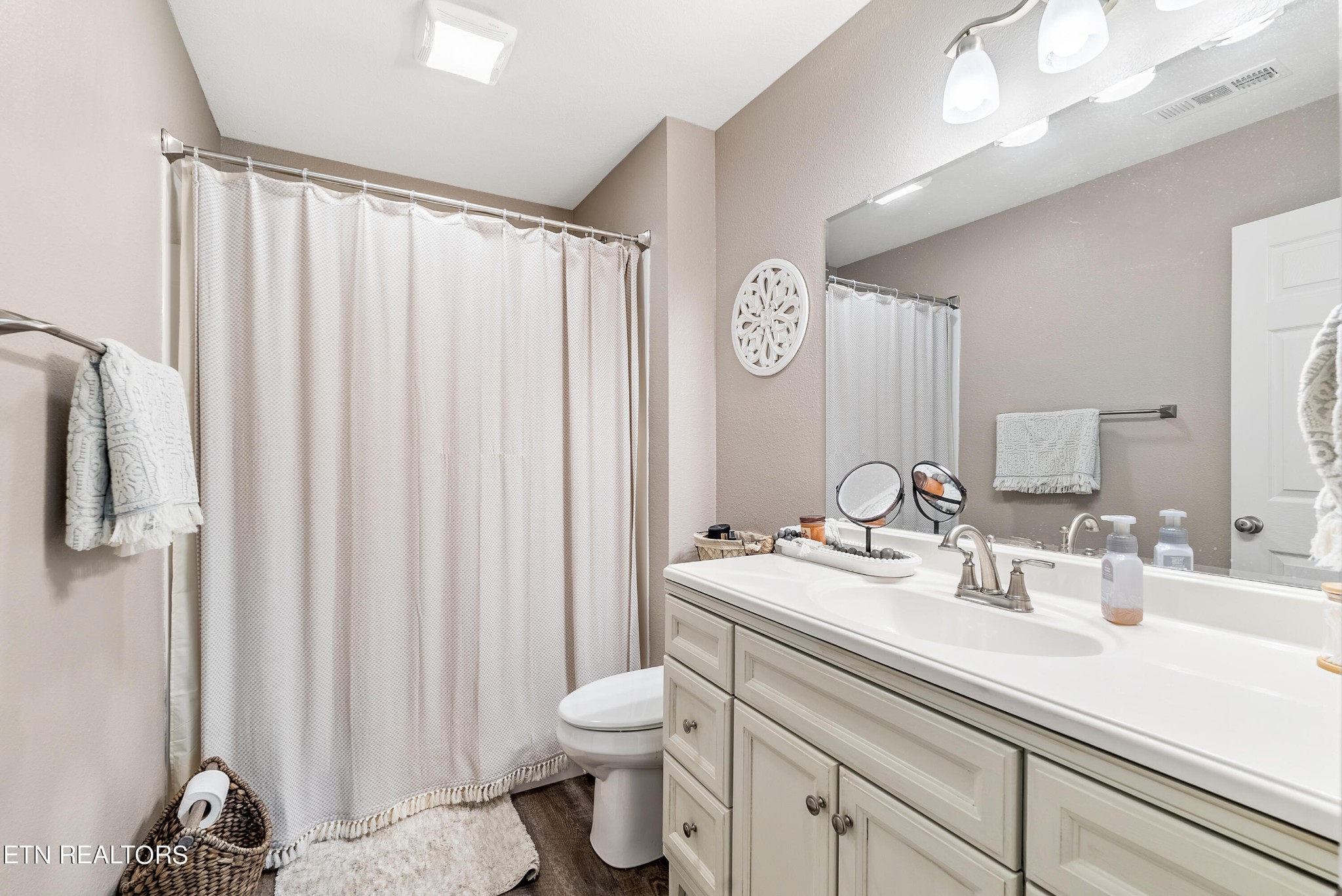 314 Two View Road Sevierville, TN 37863 - Photo 19 of 31 a bathroom with a sink a toilet and shower curtain