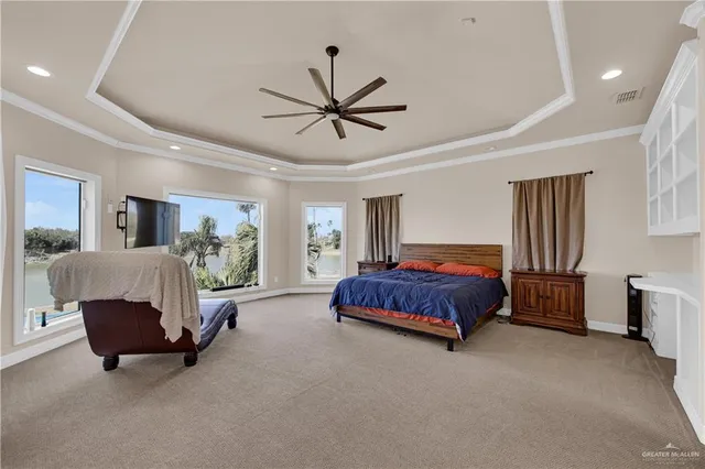 a bathroom with a tub sink vanity granite and a shower