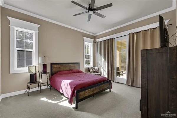 a bedroom with a bed lamp and window