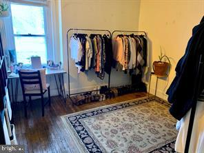 419 Green Lane, Unit 3 Philadelphia, PA 19128 - Photo 15 of 32 a view of walk in closet with clothes and shoes