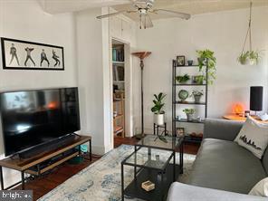 419 Green Lane, Unit 3 Philadelphia, PA 19128 - Photo 16 of 32 a living room with furniture and a flat screen tv
