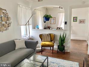 419 Green Lane, Unit 3 Philadelphia, PA 19128 - Photo 28 of 32 a living room with furniture and a potted plant