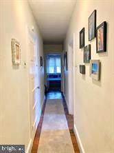 419 Green Lane, Unit 3 Philadelphia, PA 19128 - Photo 4 of 32 a view of a hallway with a white walls