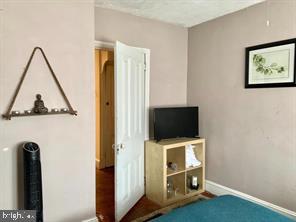 419 Green Lane, Unit 3 Philadelphia, PA 19128 - Photo 9 of 32 a view of workspace with furniture and flat screen tv