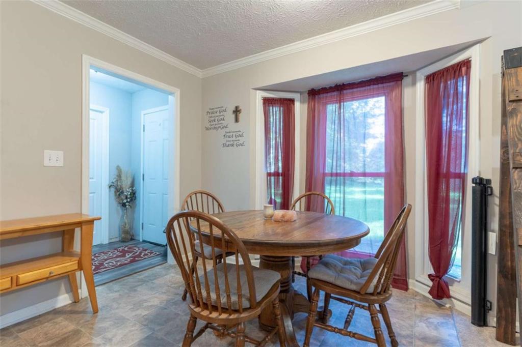 115 Woodland Ridge Circle Covington, GA 30016 - Photo 14 of 30 a view of a dining room with furniture window and outside view