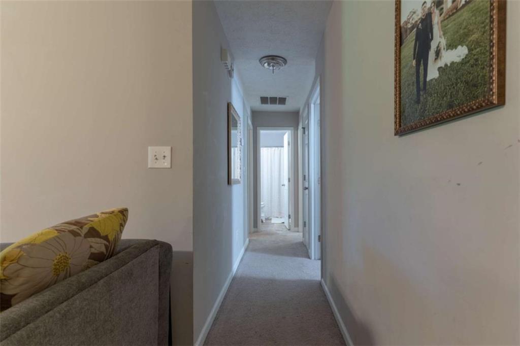 115 Woodland Ridge Circle Covington, GA 30016 - Photo 16 of 30 a living room with furniture and a gate