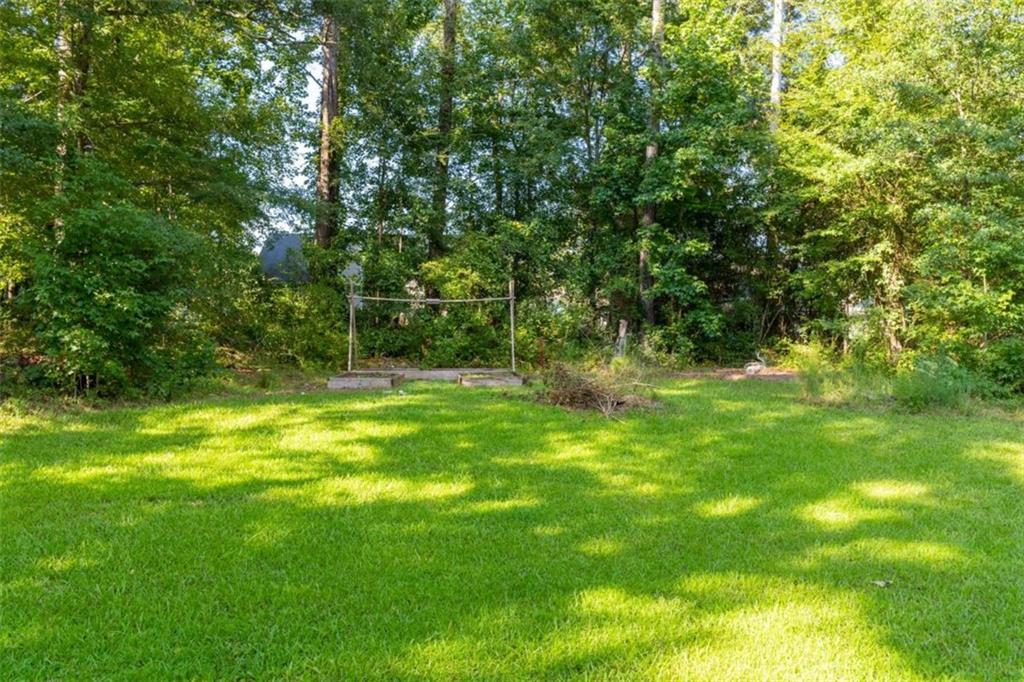 115 Woodland Ridge Circle Covington, GA 30016 - Photo 30 of 30 a view of outdoor space with deck and yard
