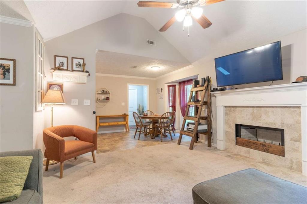 115 Woodland Ridge Circle Covington, GA 30016 - Photo 4 of 30 a living room with furniture and a fireplace
