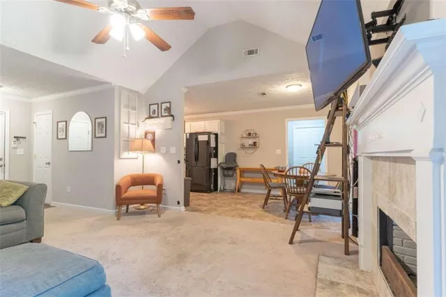 a living room with furniture and a fireplace