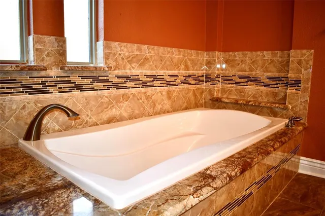 a view of a swimming pool and an outdoor seating