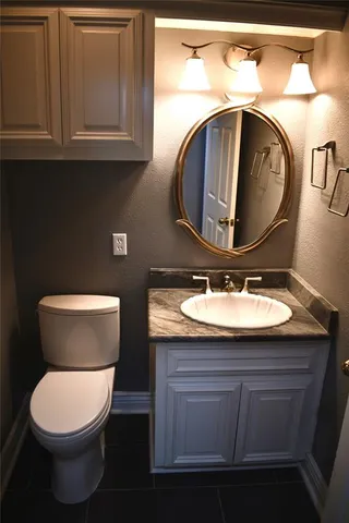 a bathroom with a toilet and a sink