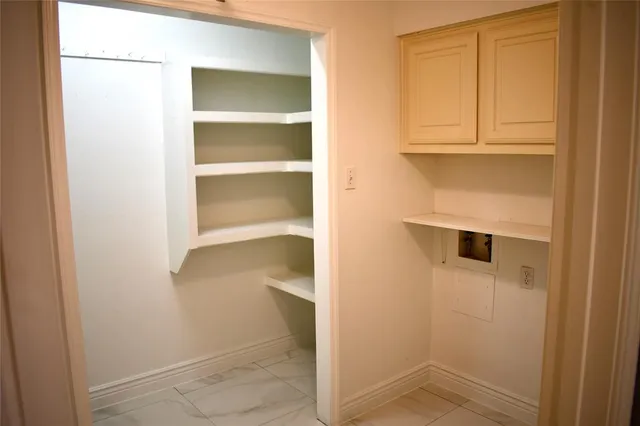 a view of an empty walk in closet