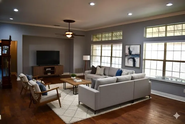 a living room with furniture and a flat screen tv