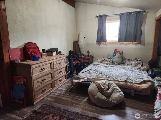 a bedroom with a bed and a couch