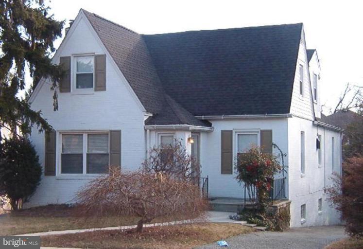 509 Dunkirk Road Baltimore, MD 21212 - Photo 1 of 1 a front view of a house with a yard and garage