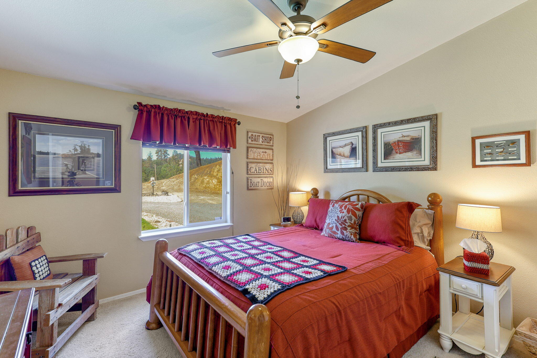 551 Lewiston Road Lewiston, CA 96052 - Photo 28 of 51 a bedroom with a bed and a chandelier