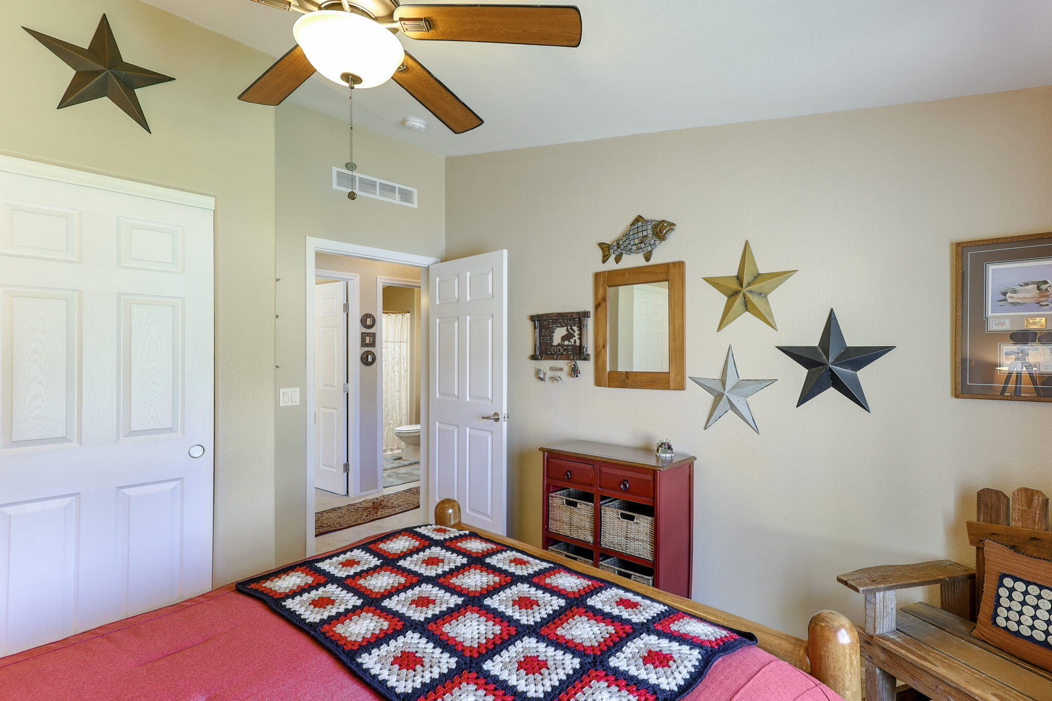 551 Lewiston Road Lewiston, CA 96052 - Photo 29 of 51 a bedroom with a bed and a chandelier