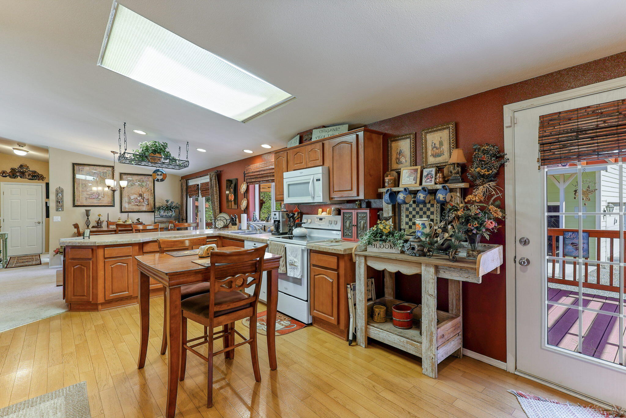 551 Lewiston Road Lewiston, CA 96052 - Photo 10 of 51 a kitchen with stainless steel appliances kitchen island granite countertop a table and chairs in it