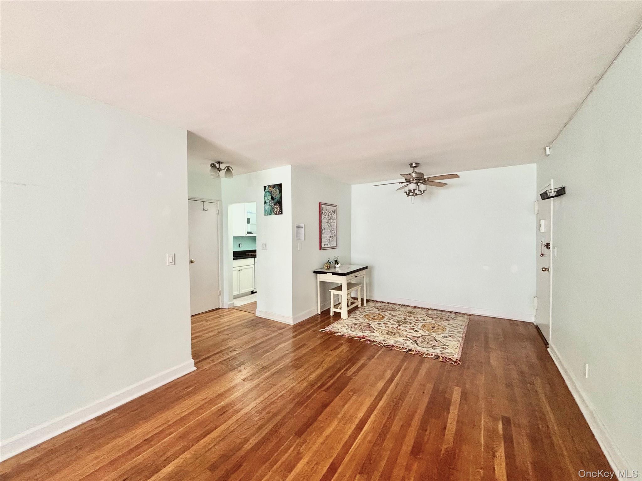 804 Bronx River Road, Unit 4G Bronxville, NY 10708 - Photo 3 of 11 a view of a room with wooden floor and a sink