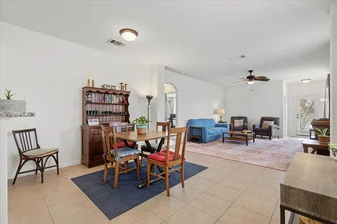 a view of a livingroom with furniture and a bookshelf
