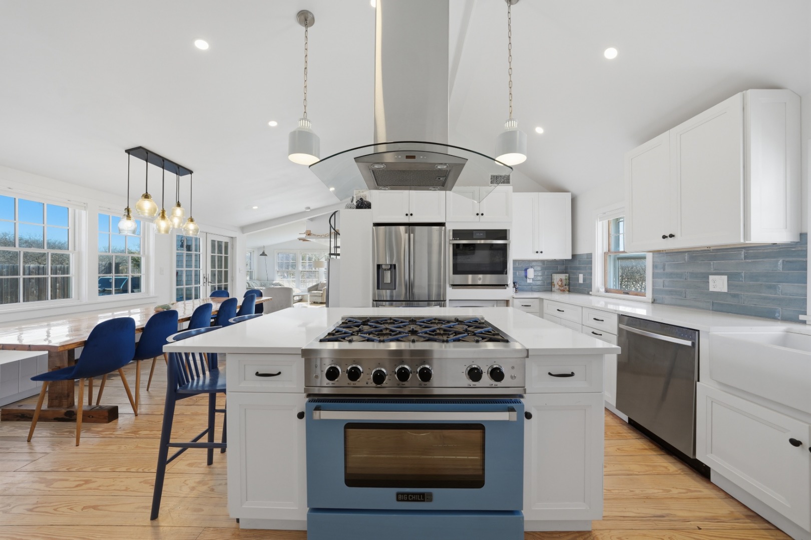 1 H Street Nantucket, MA 02554 - Photo 2 of 18 a kitchen with a stove top oven and cabinets