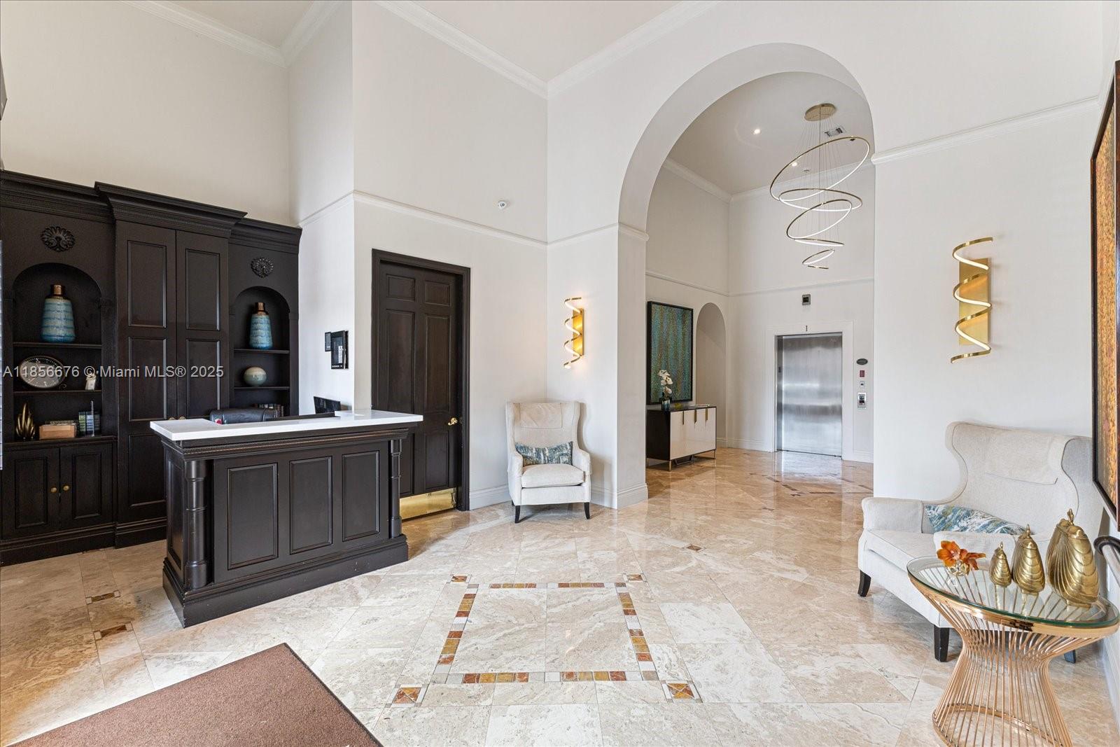 651 Okeechobee Boulevard, Unit 1002 West Palm Beach, FL 33401 - Photo 17 of 22 a living room with furniture and a wooden floor