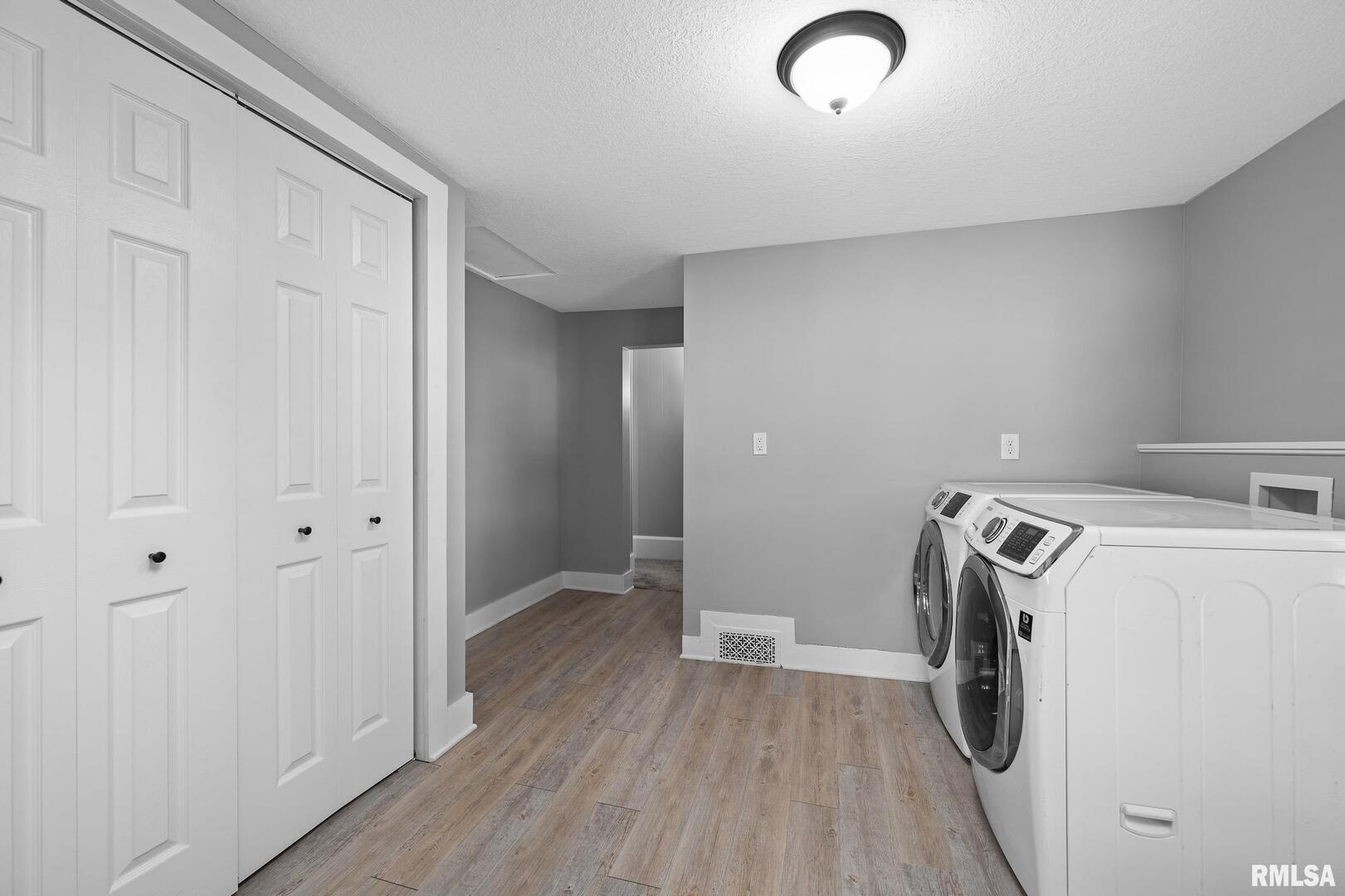 118 South 1st Street Long Grove, IA 52756 - Photo 25 of 41 a view of a storage & utility room with a washer dryer