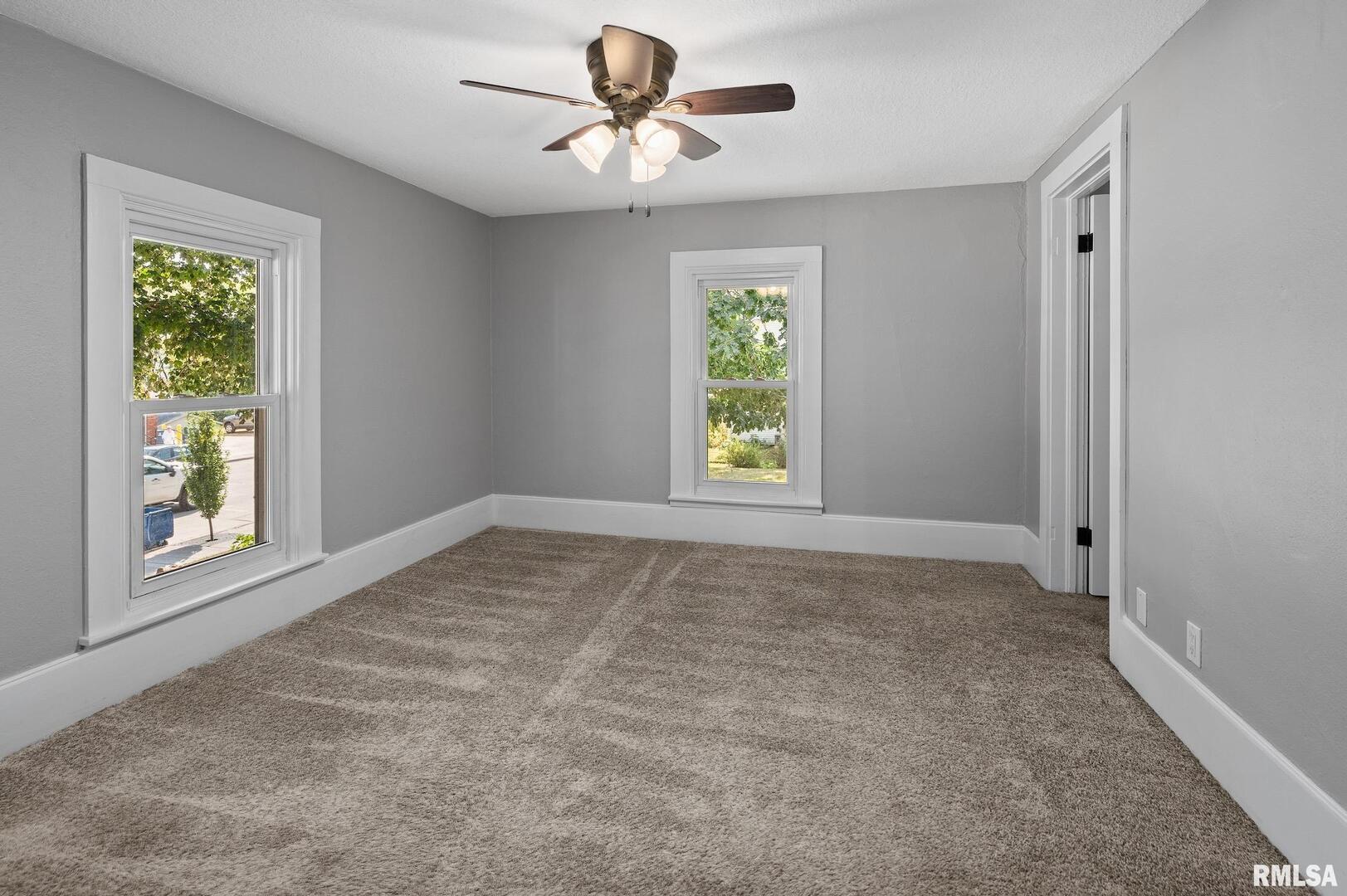 118 South 1st Street Long Grove, IA 52756 - Photo 31 of 41 a view of an empty room with a window