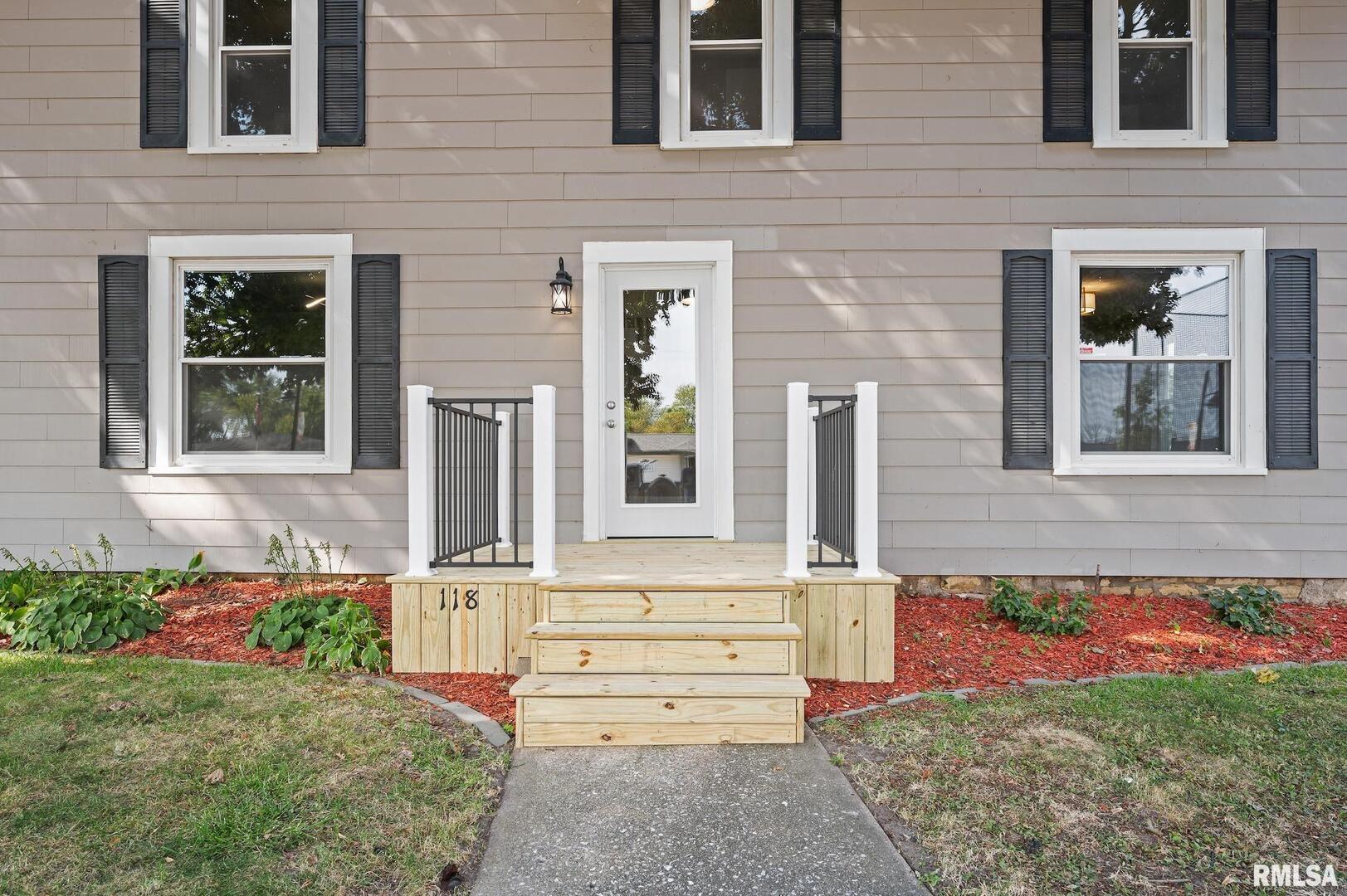 118 South 1st Street Long Grove, IA 52756 - Photo 35 of 41 a front view of a house with a yard
