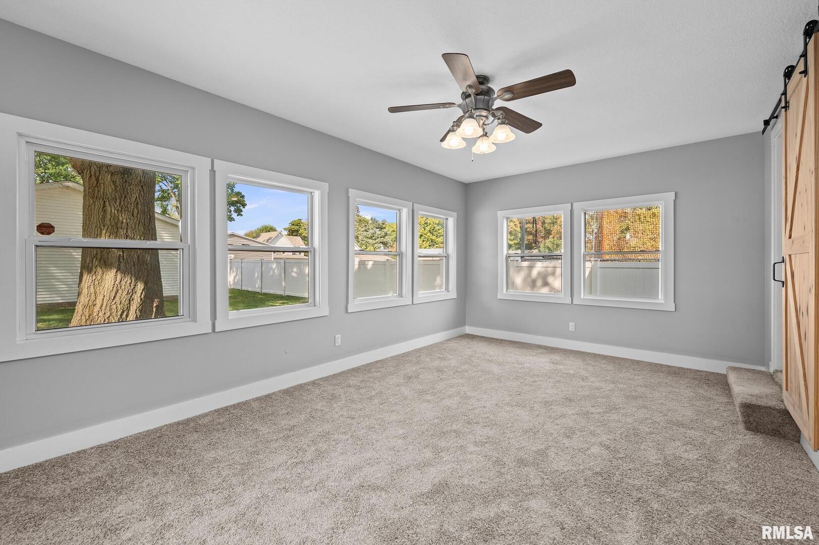 118 South 1st Street Long Grove, IA 52756 - Photo 7 of 41 a view of an empty room with a window