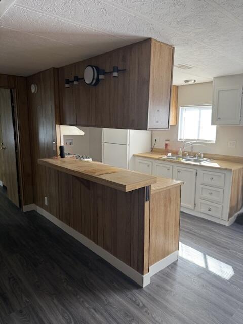 216 Imperial Avenue Thermal, CA 92274 - Photo 14 of 15 a kitchen with a sink a stove a refrigerator and cabinets