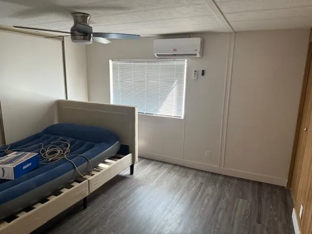 a white toilet sitting next to a shower curtain