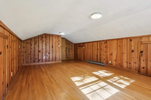 a view of wooden floor and windows in a room