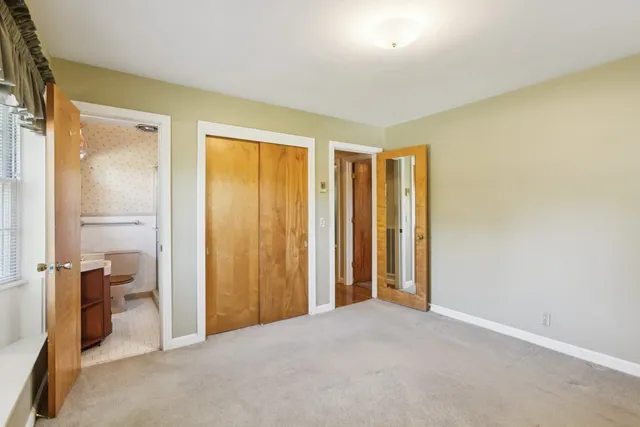 a view of a room with a bathroom