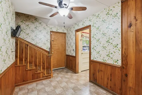 workspace with wooden floor windows and fan