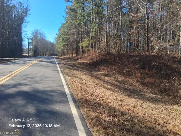 a view of a yard with trees