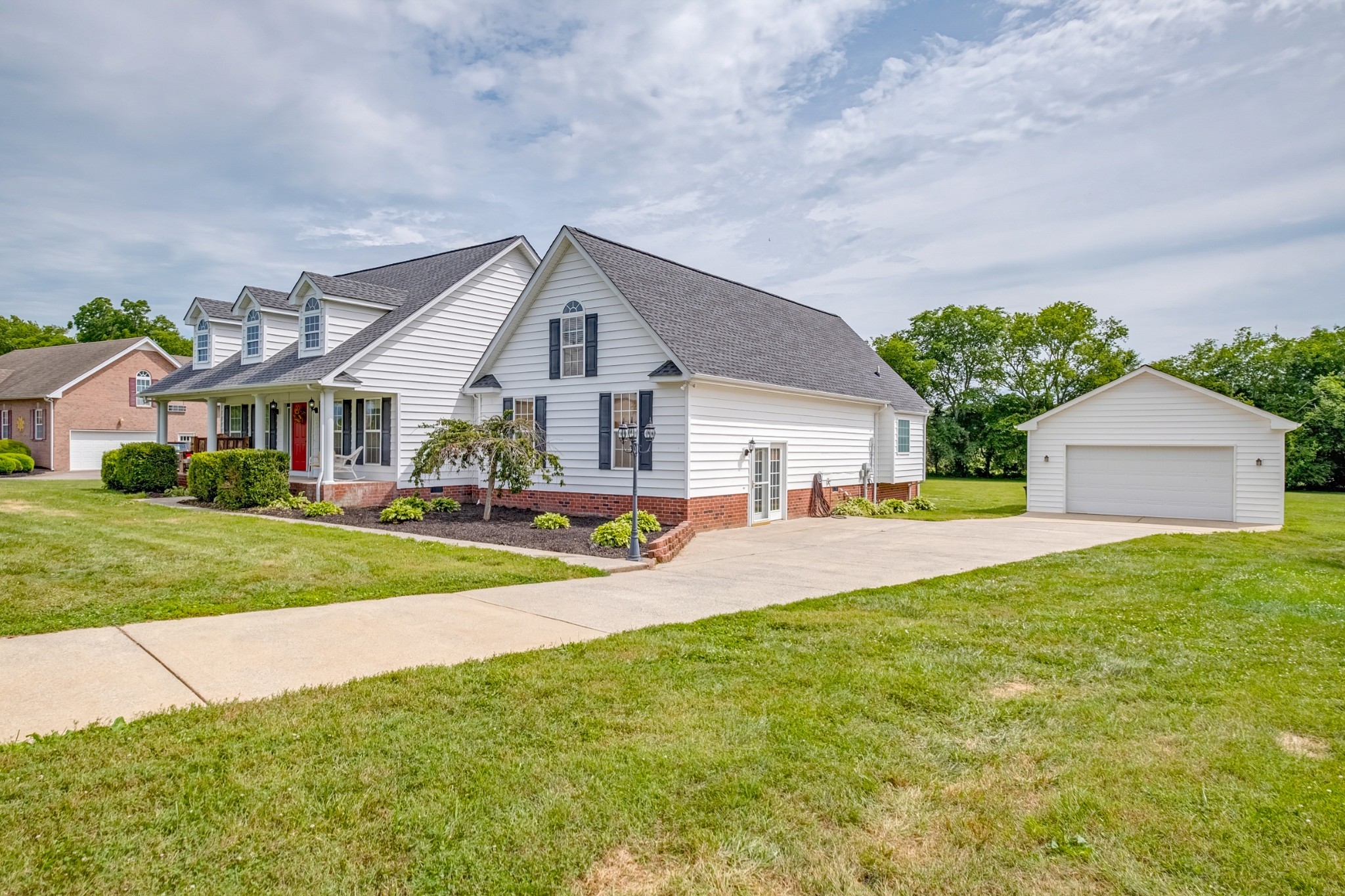 1043 Emerald Way Castalian Springs, TN 37031 - Photo 3 of 45 a front view of house with yard and green space