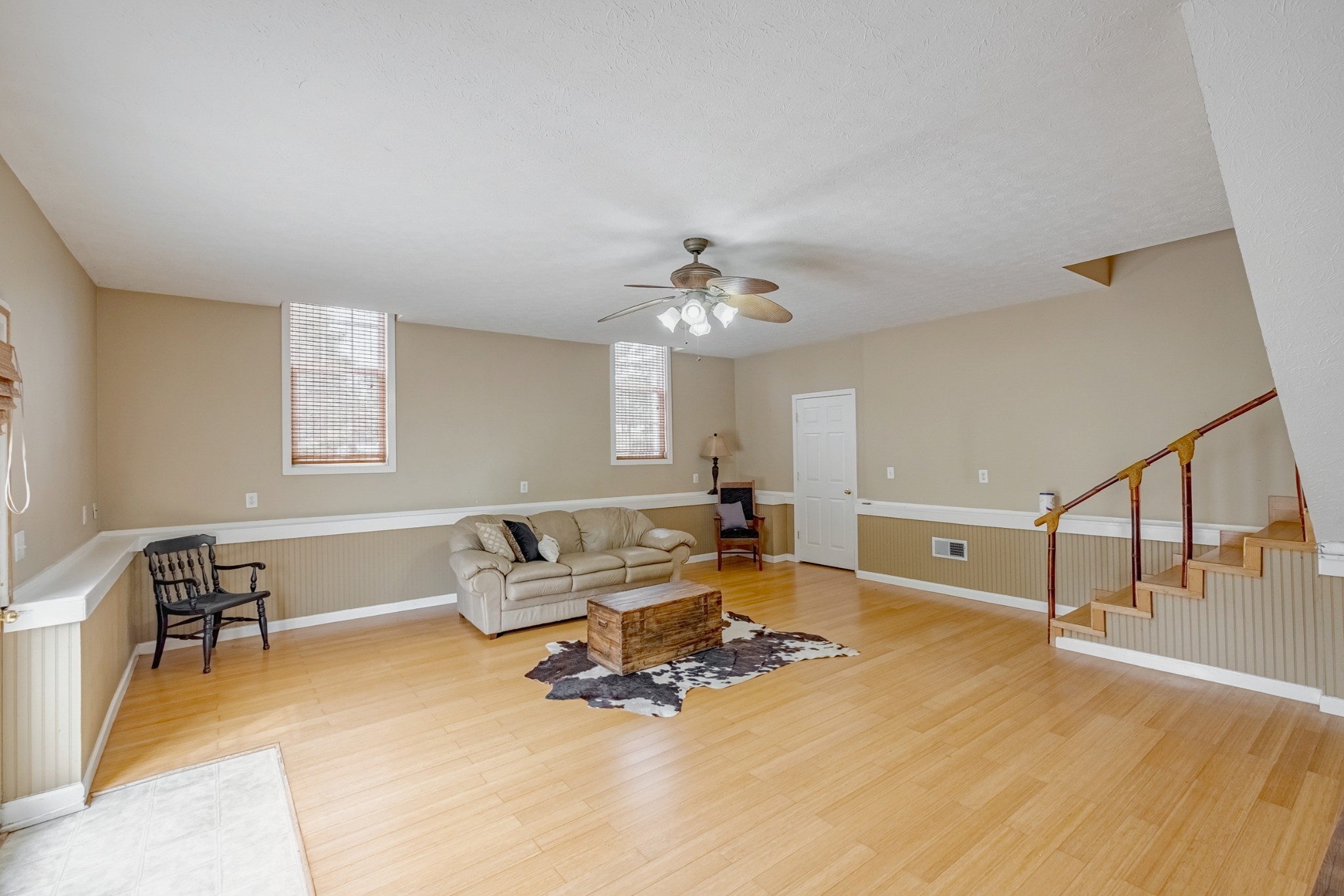 1043 Emerald Way Castalian Springs, TN 37031 - Photo 33 of 45 a living room with furniture and a wooden floor
