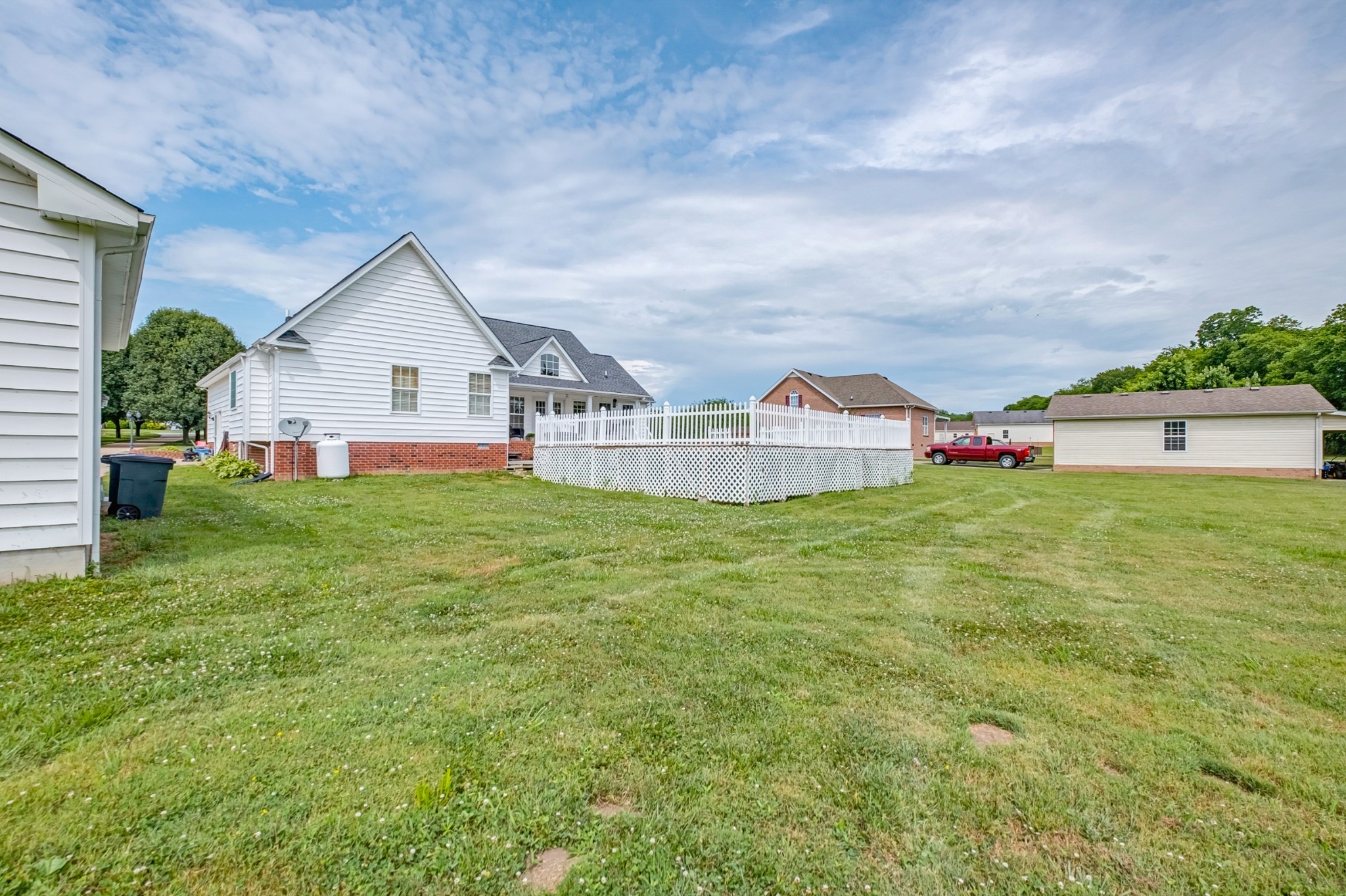 1043 Emerald Way Castalian Springs, TN 37031 - Photo 37 of 45 a view of a house with a yard and sitting area