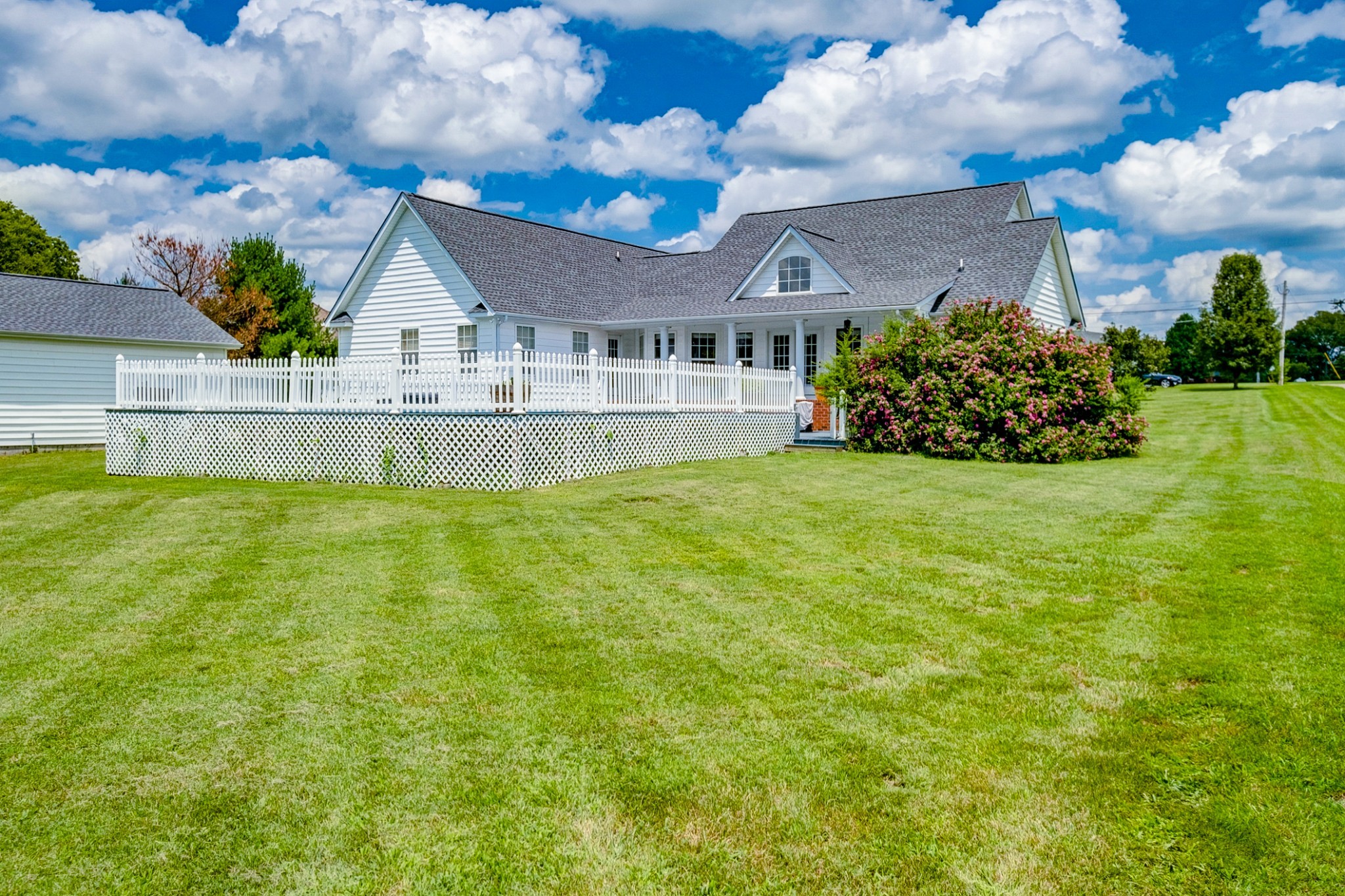 1043 Emerald Way Castalian Springs, TN 37031 - Photo 41 of 45 a view of a house with a big yard and a large pool