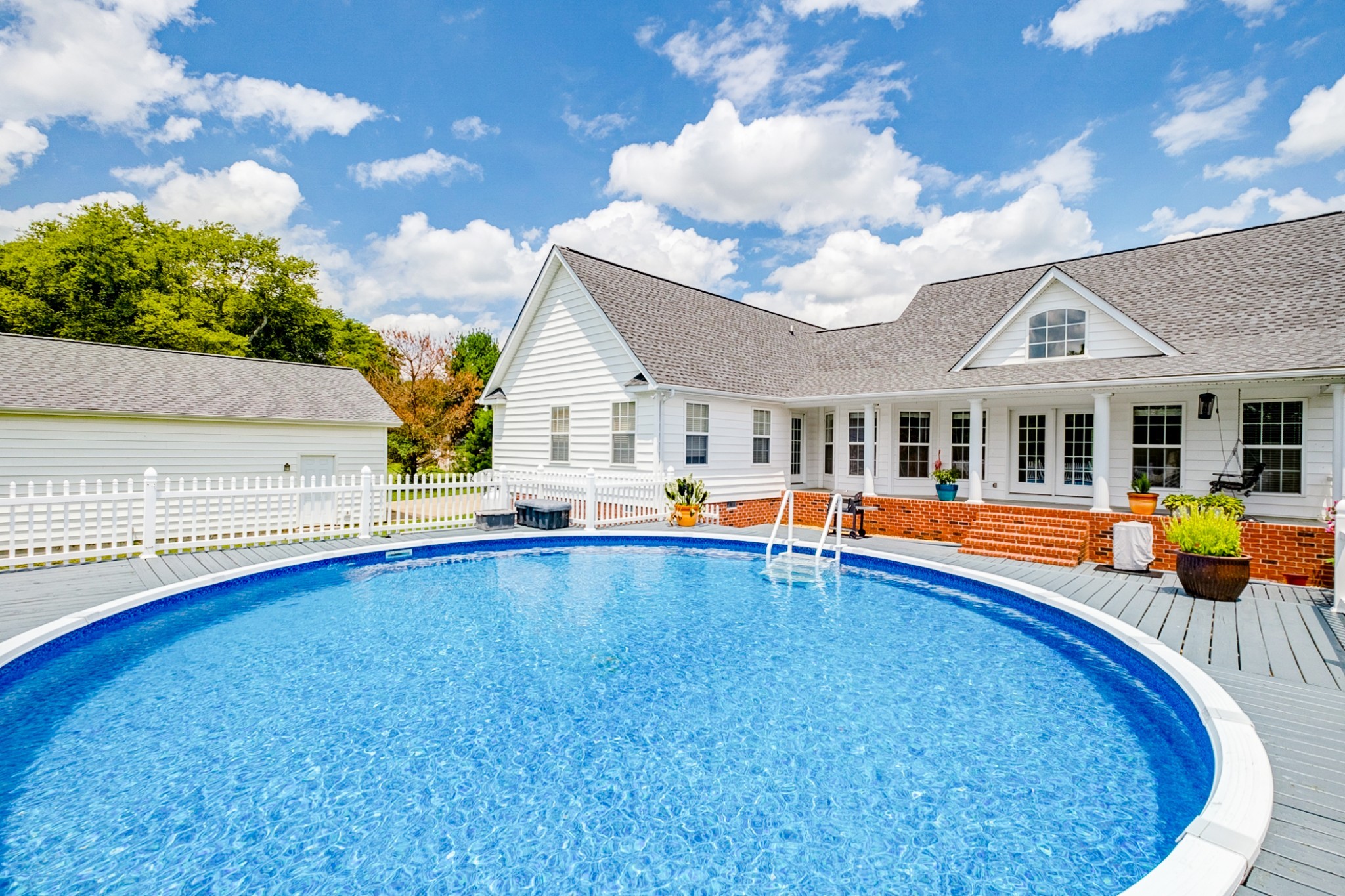 1043 Emerald Way Castalian Springs, TN 37031 - Photo 45 of 45 a view of an house with swimming pool and porch