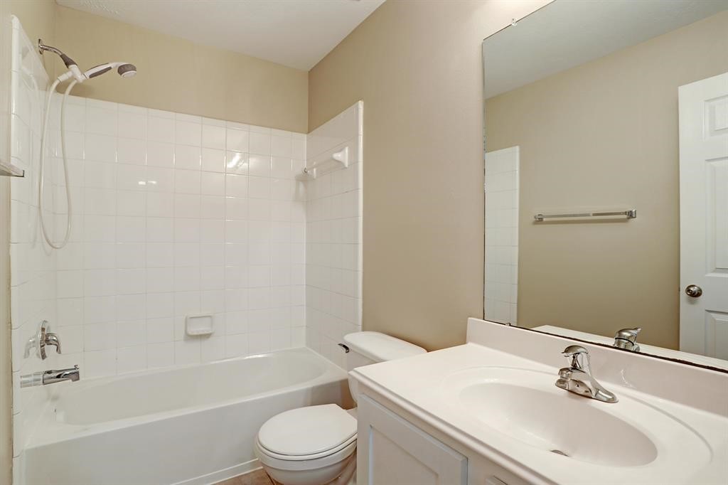 281 Brandy Ridge Lane Dickinson, TX 77539 - Photo 7 of 10 a bathroom with a sink toilet and shower