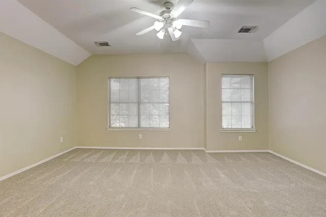 a bathroom with a double vanity sink mirror and shower