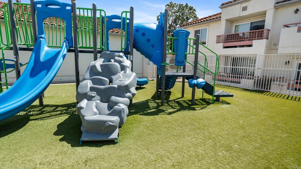 415 Stoney Point Way, Unit 106 Oceanside, CA 92058 - Photo 28 of 35 a view of an chairs in front of building