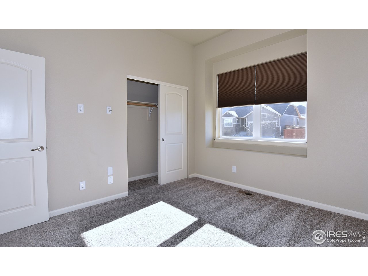 882 Wagon Bend Road Berthoud, CO 80513 - Photo 14 of 31 Second bedroom with south-facing window.